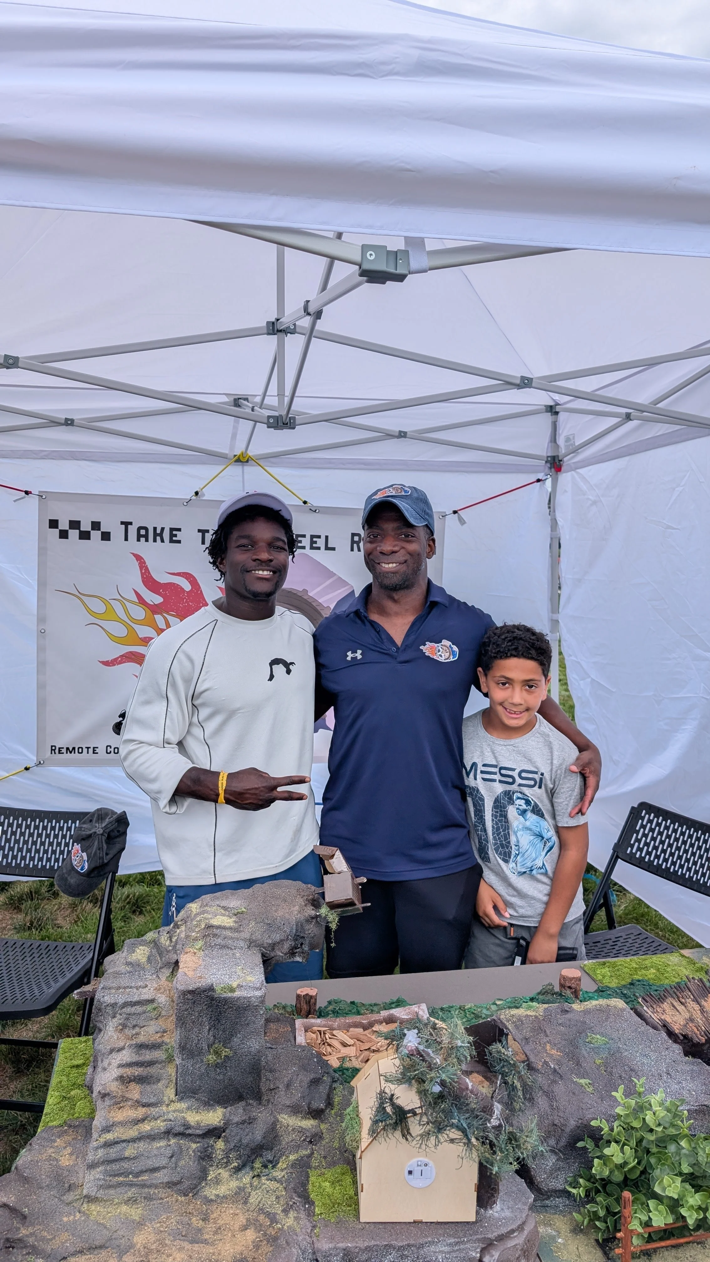 Frederick "Flips" Richard, US Olympian, visits owner of Take The Wheel RC at the Frederick "Flips" Fair in Stoughton, MA.