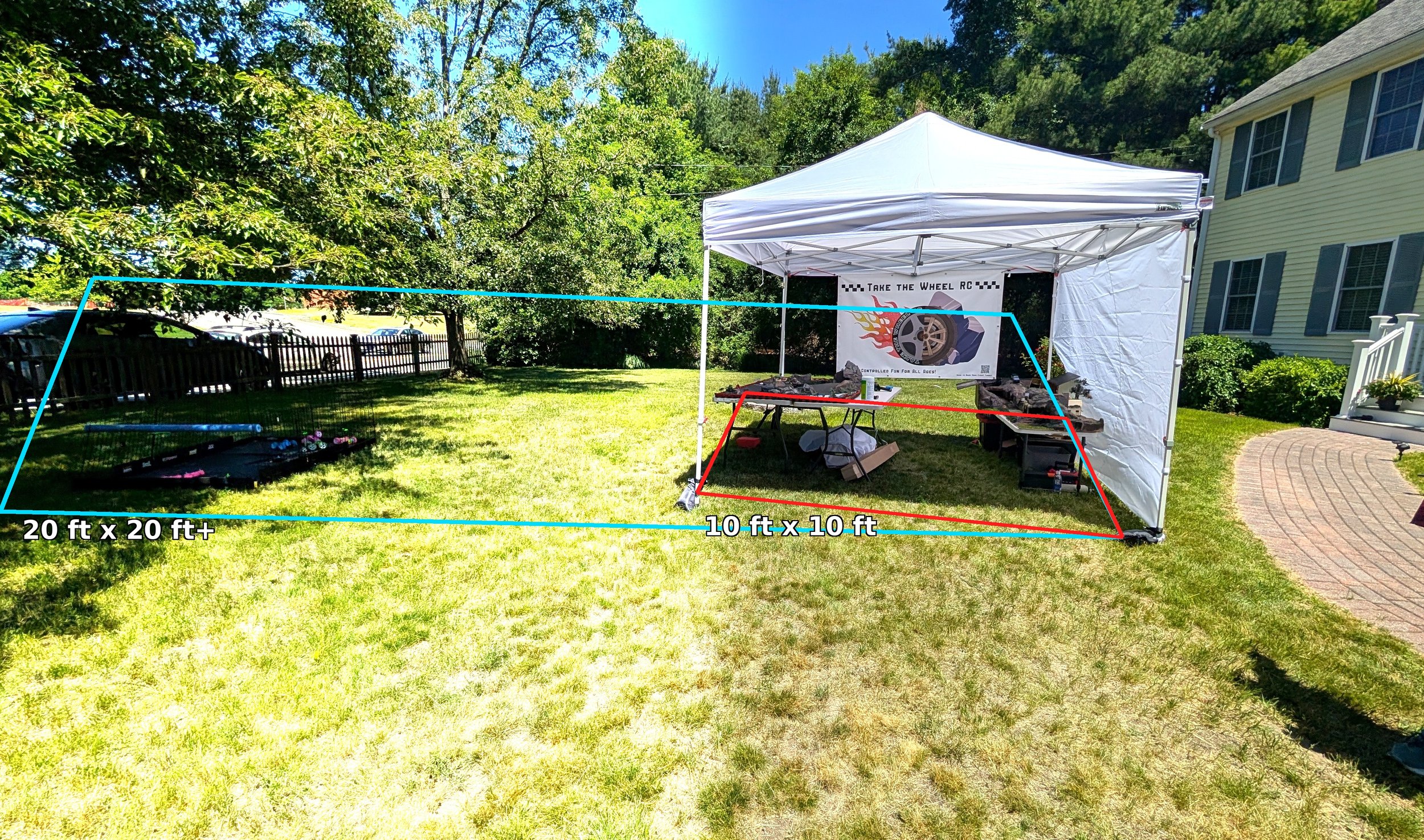 A white outdoor canopy tent set up on grass with a banner that reads 'Take the Wheel RC'. The tent has a table underneath with RC cars. Marked boundary lines for a race track are drawn in the image, with dimensions 20 ft x 20 ft and 10 ft x 10 ft labeled.