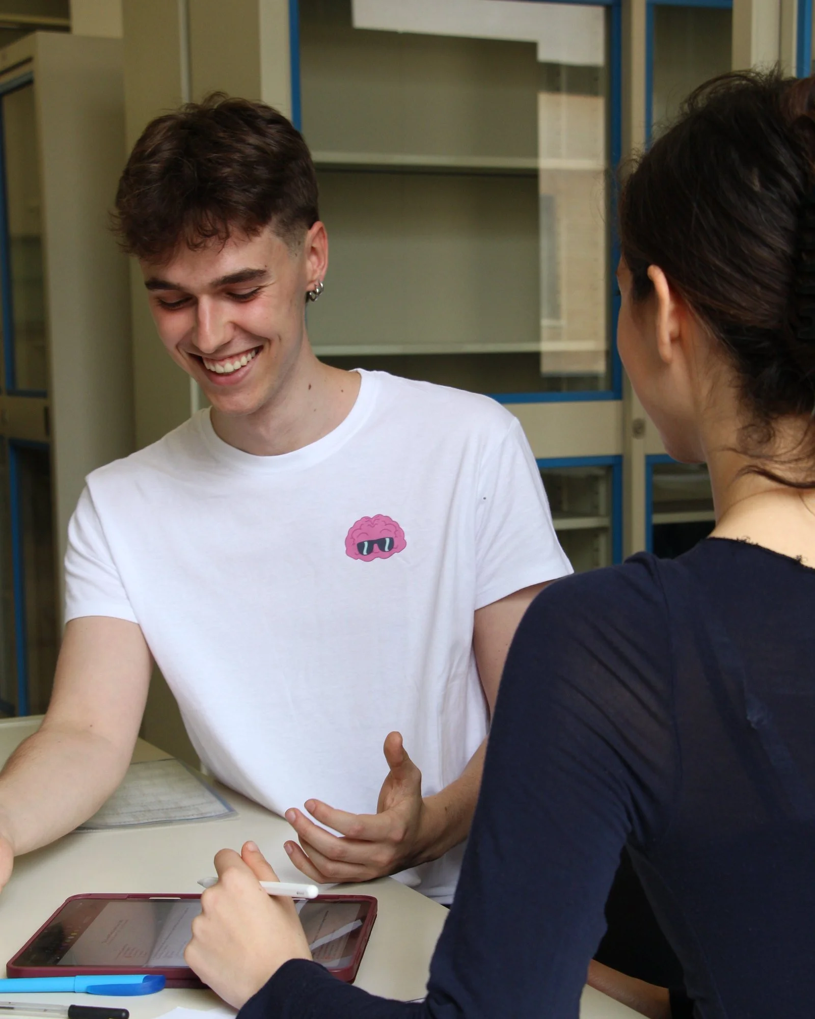 Alex explaining a question in the Sapienza library
