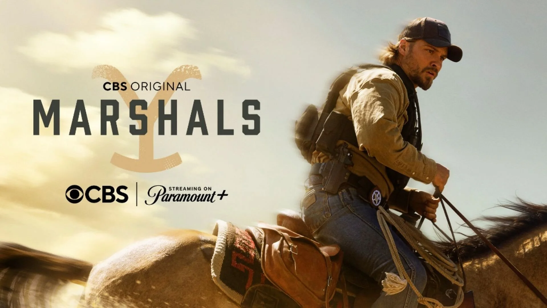 Luke Grimes as Kayce Dutton riding a horse as a U.S. Marshal in a scene from the neo-Western series Marshals.