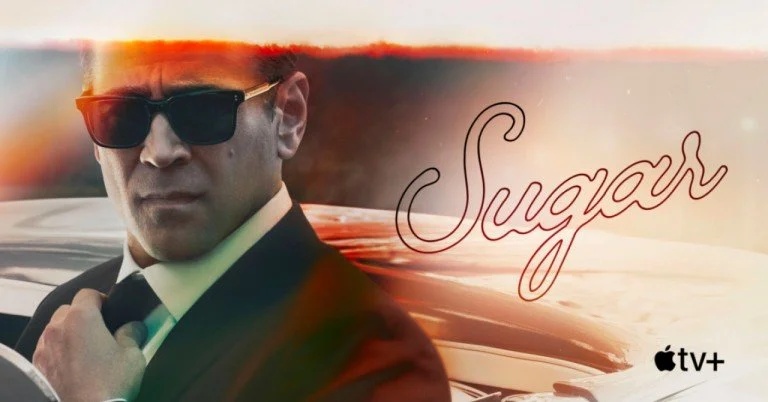 A man wearing sunglasses and a suit adjusting his tie in front of a car, with a sunset background and the word 'Sugar' in cursive, along with the Apple TV+ logo.