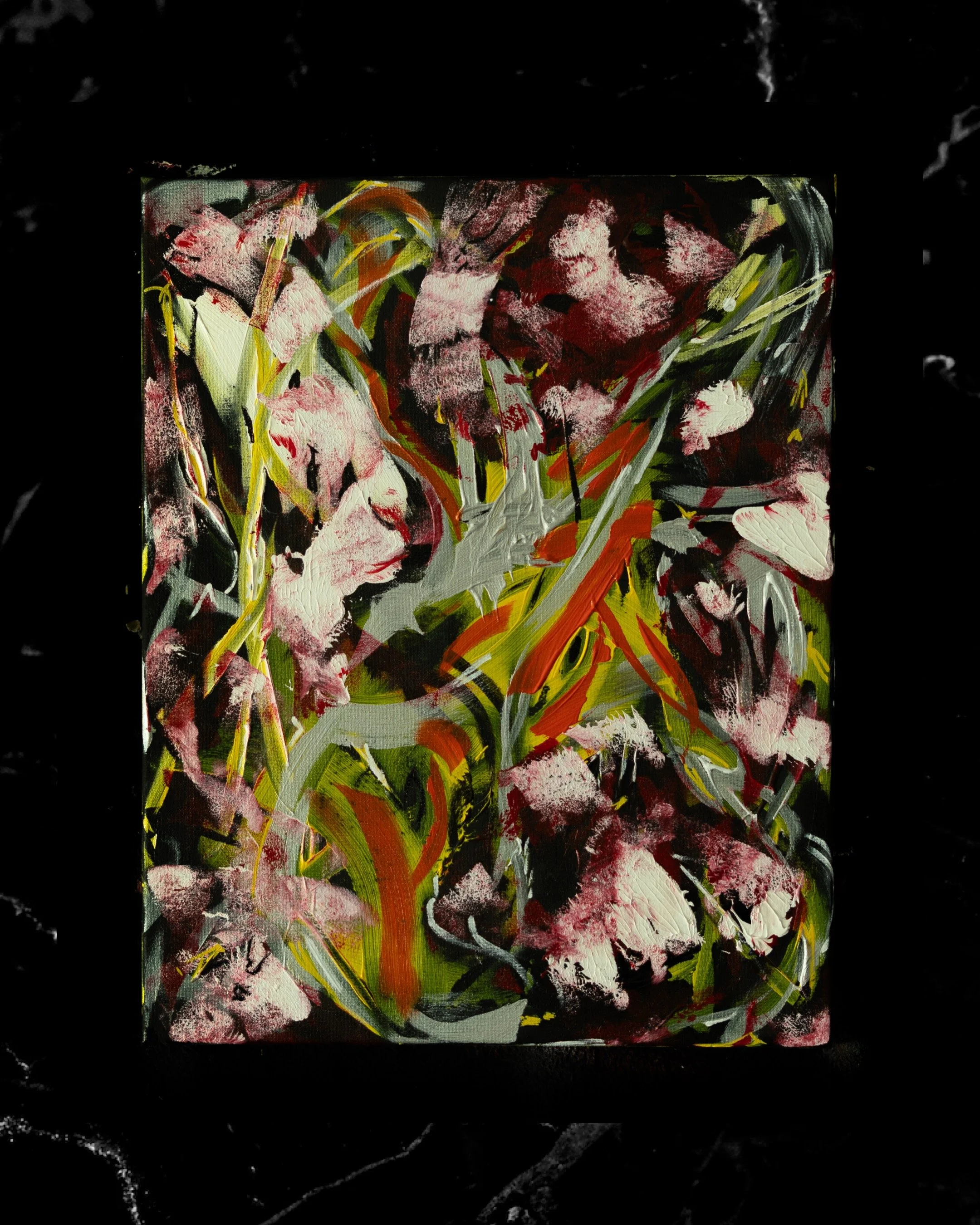 Abstract painting with splashes of pink, green, yellow, black, orange, and white on a dark background.