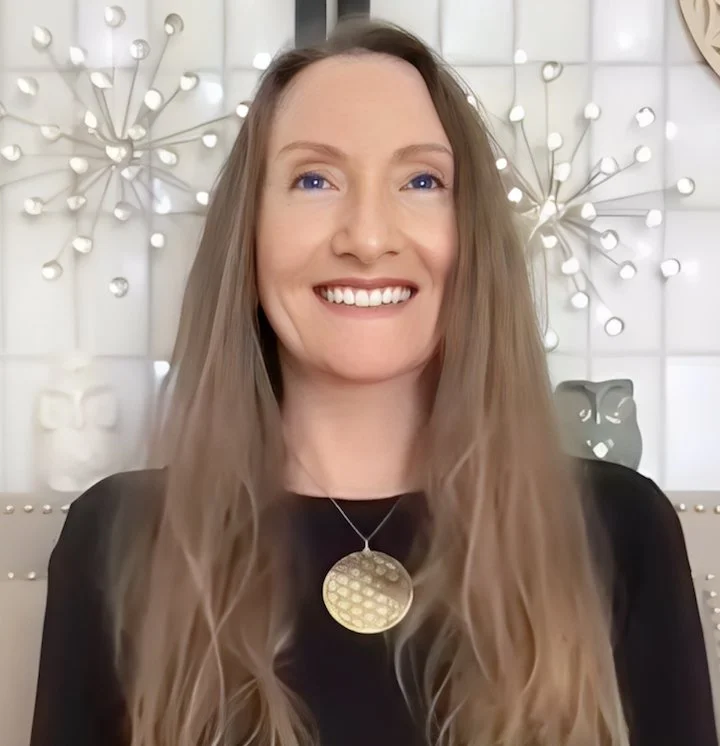 Portrait of Chenee Fournier, mentor and angel channel, in a warm, glowing space