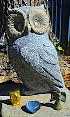 owl statue with a golden owl, ceramic angel and blue crystal heart
