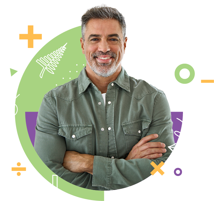 A smiling middle-aged man with gray hair and beard, wearing a green button-up shirt, standing with arms crossed in front of a colorful abstract background.
