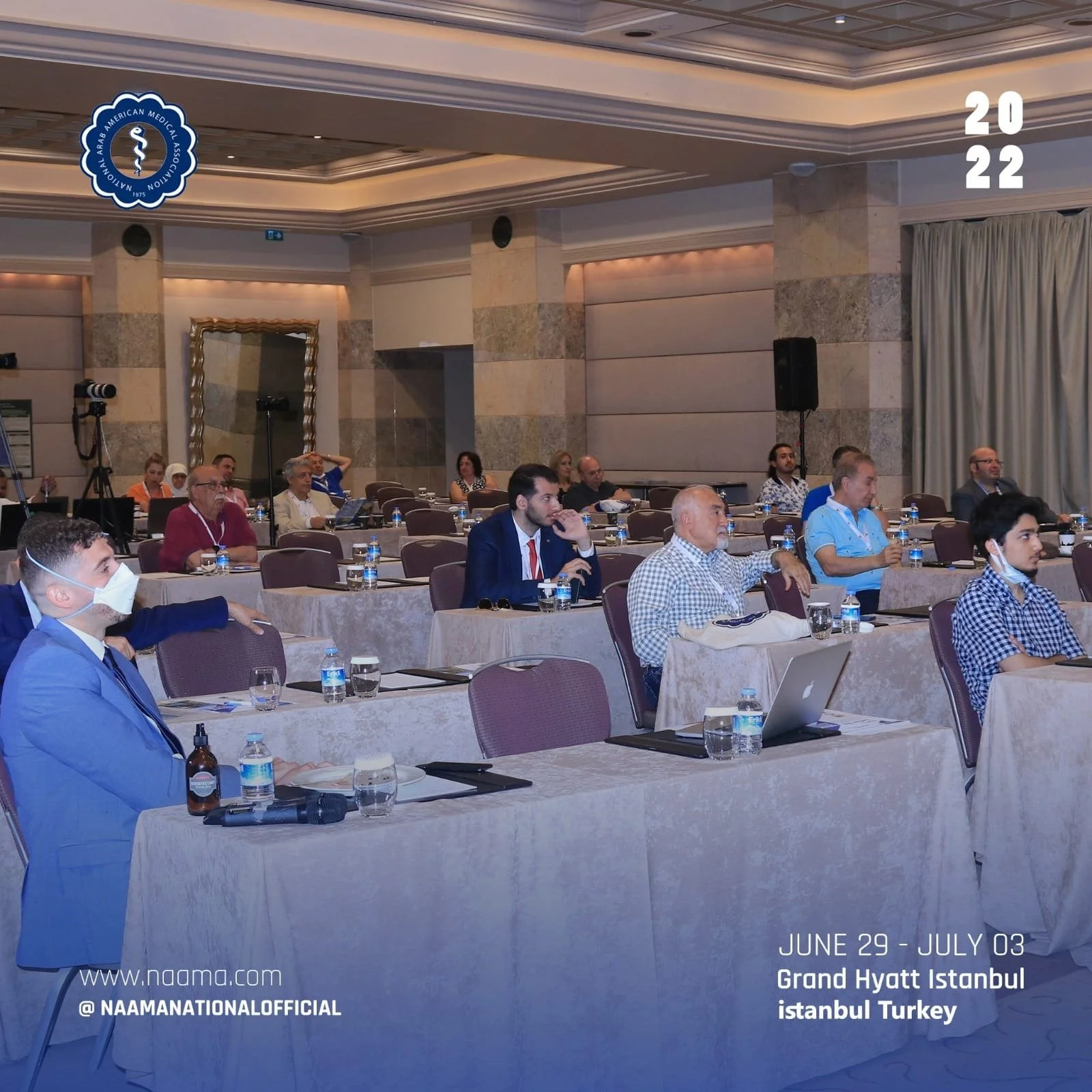 Conference attendees seated at tables in a banquet hall at the Grand Hyatt Istanbul in Istanbul, Turkey, during a medical event organized by the Arab American Medical Association from June 29 to July 3, 2022.