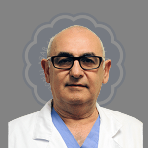 Portrait of a middle-aged man with glasses and a white medical coat against a neutral background.