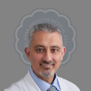 Portrait of a smiling man in a white medical coat with a blue shirt and tie, against a grey background with the Arab American Medical Association logo.