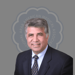 Professional headshot of a man in a suit and tie with gray hair, smiling against a gray background with a circular logo.
