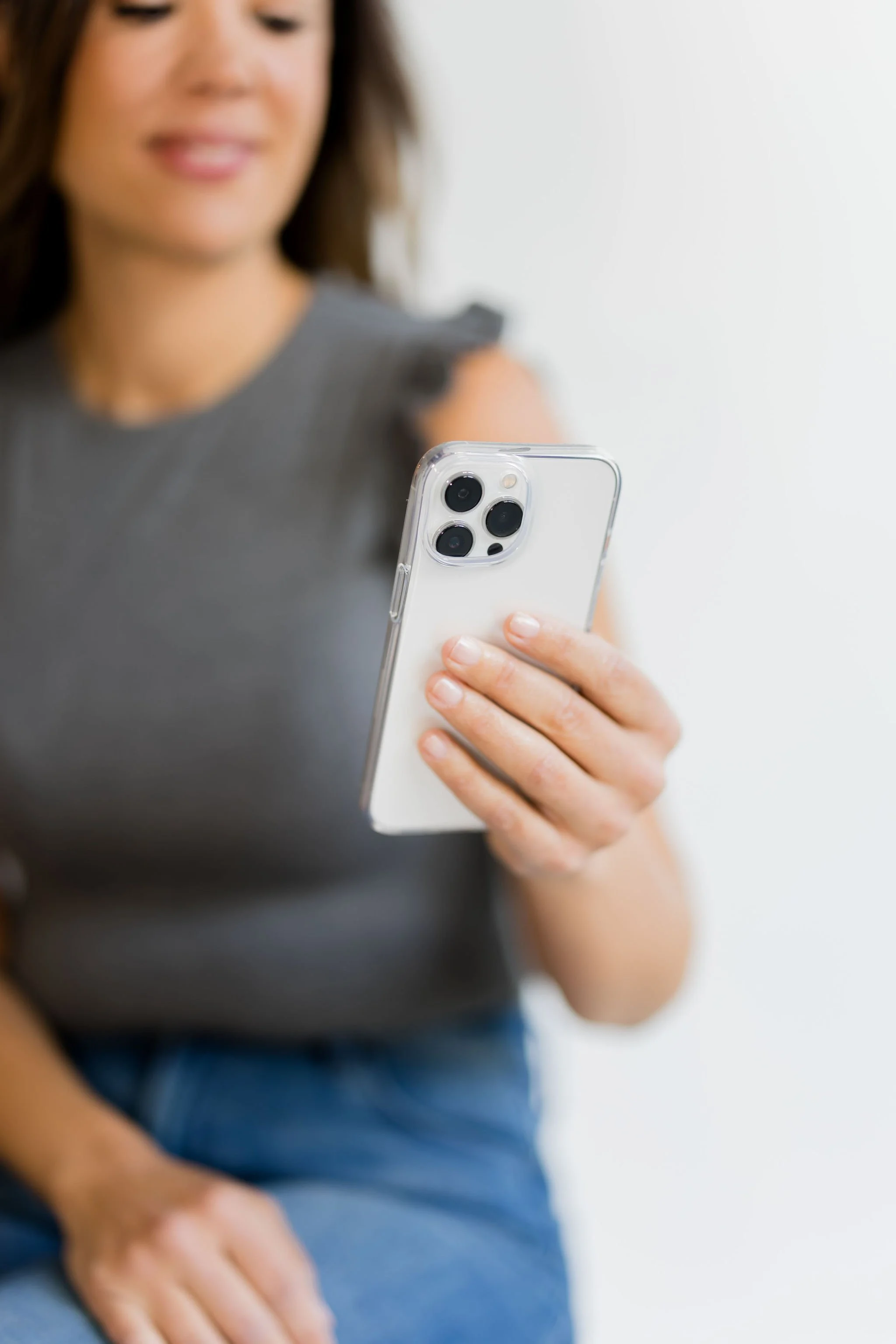 Social media manager holding phone