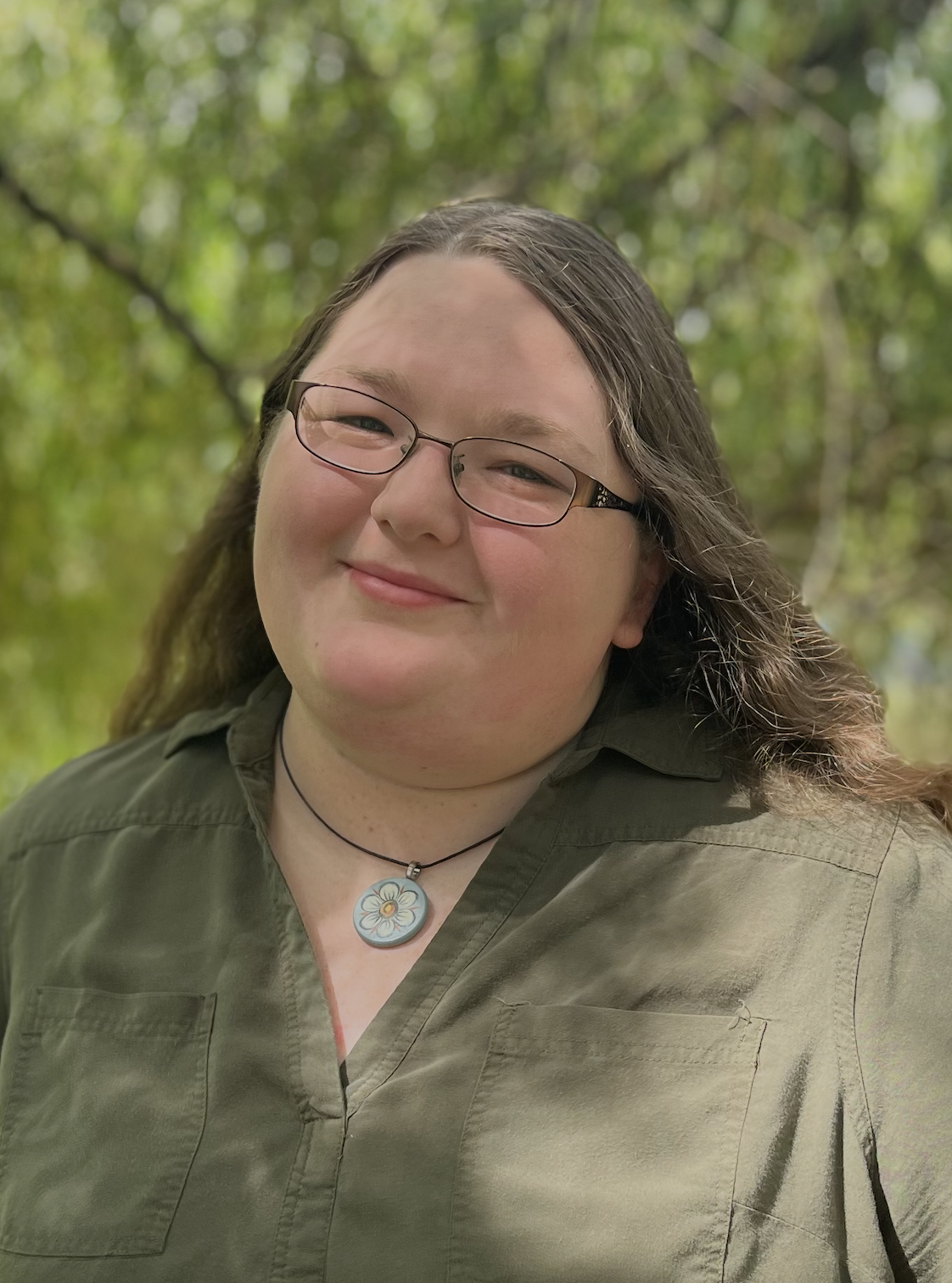 Marie is a trauma therapist in Newberg who provides telehealth across Oregon. She is a white woman with glasses and smiles at the camera.