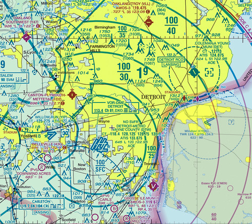 Section of a navigational chart showing Detroit, Michigan, with airspace boundaries, altitude restrictions, and aeronautical navigation details.