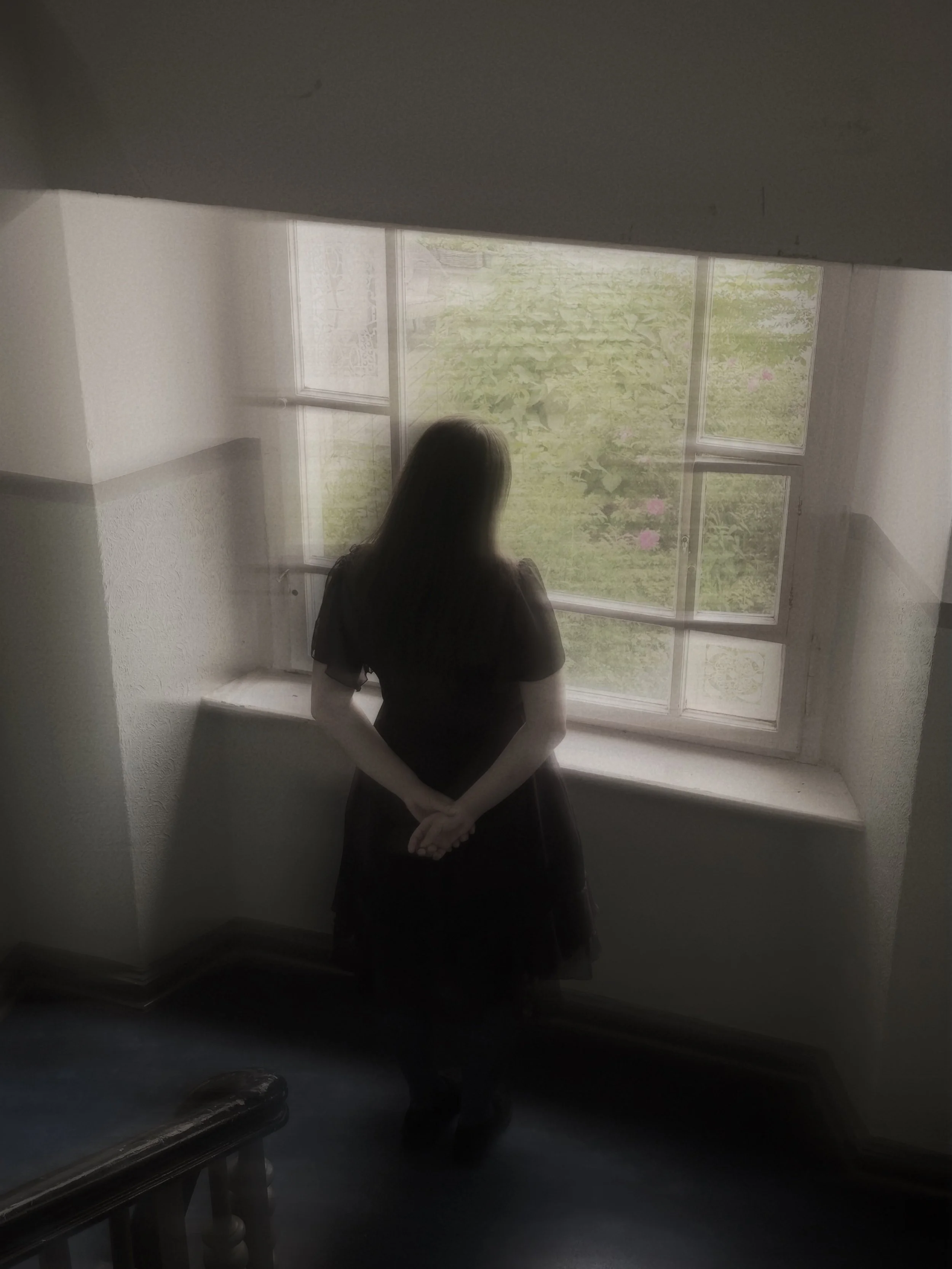 Ghost Woman at Window Wearing Black Dress Arms Crossed