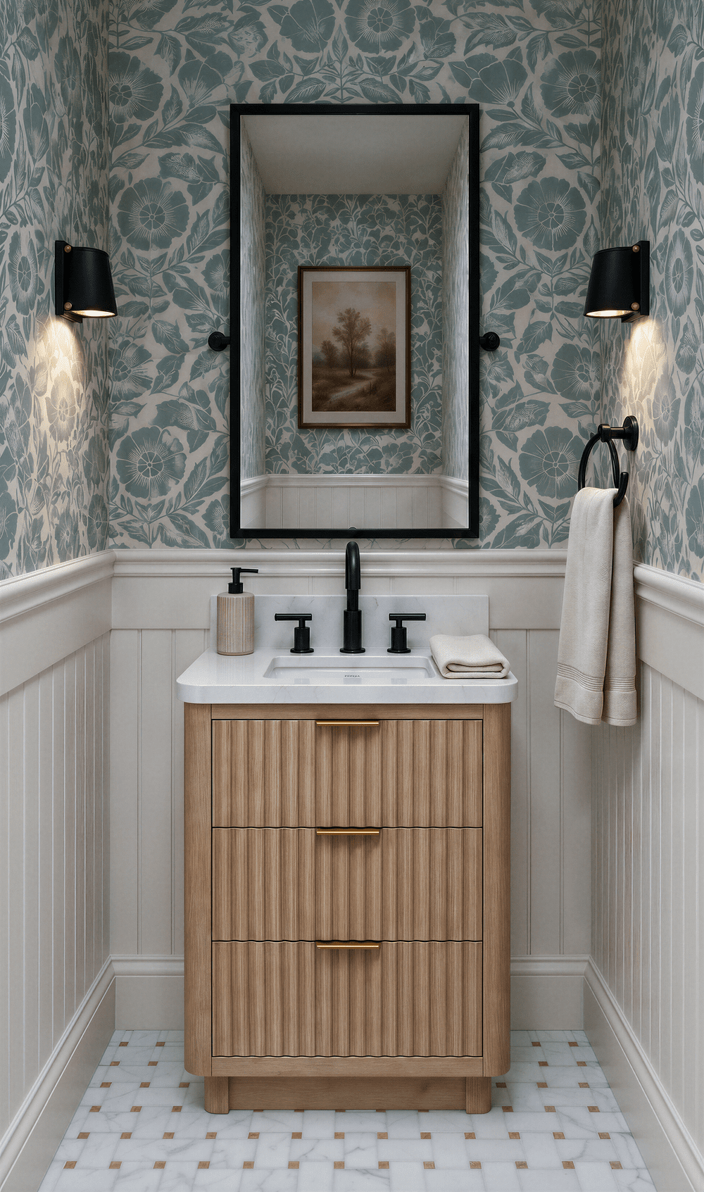 Powder room at Nora with a bold blue-green floral wallpaper over beadboard wainscoting, a fluted wood vanity, a pivot mirror, matte black fixtures, and a marble mosaic floor.