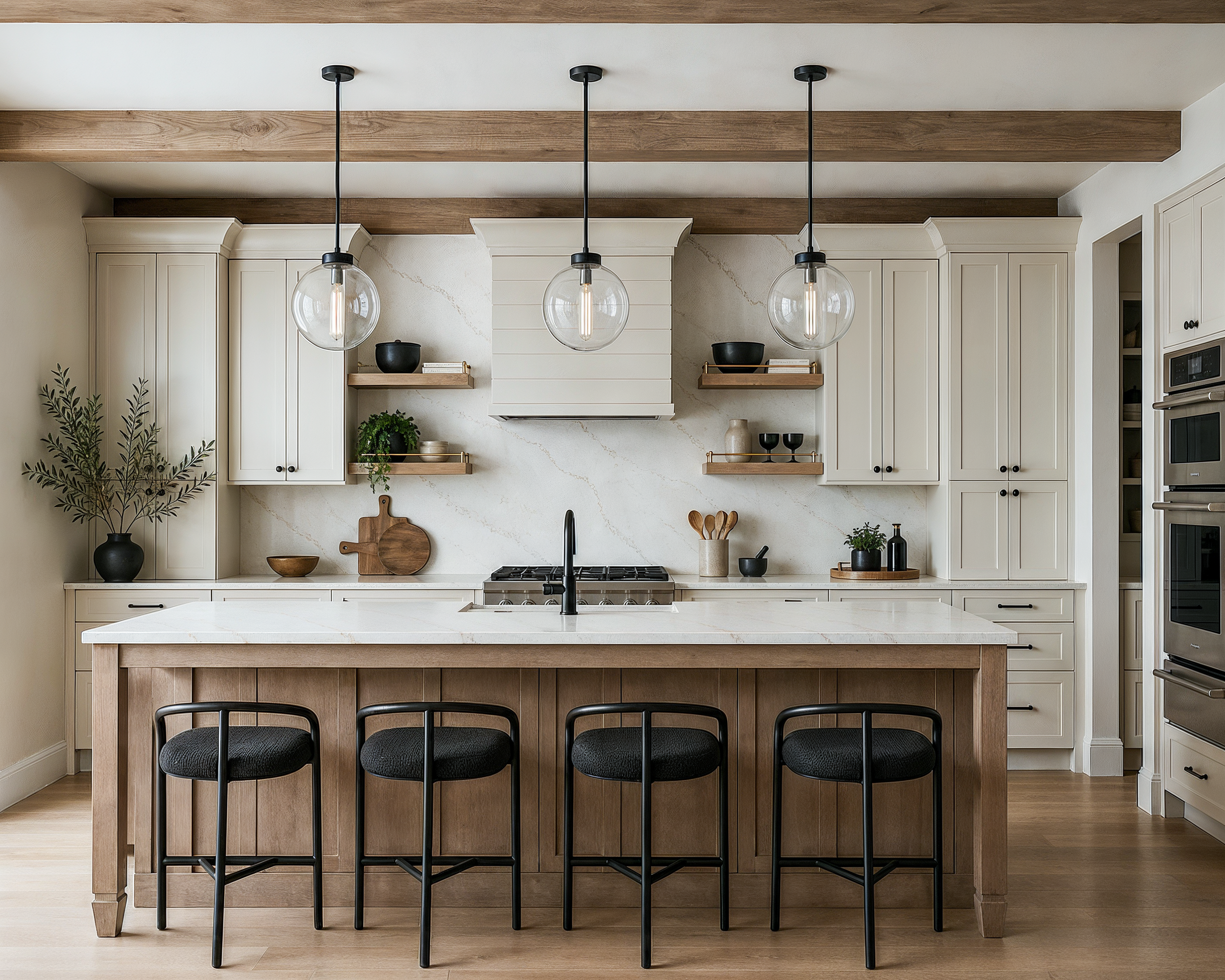 The kitchen of the Perry home, with a professional range, light wood cabinetry, and a long quartz slab backsplash.