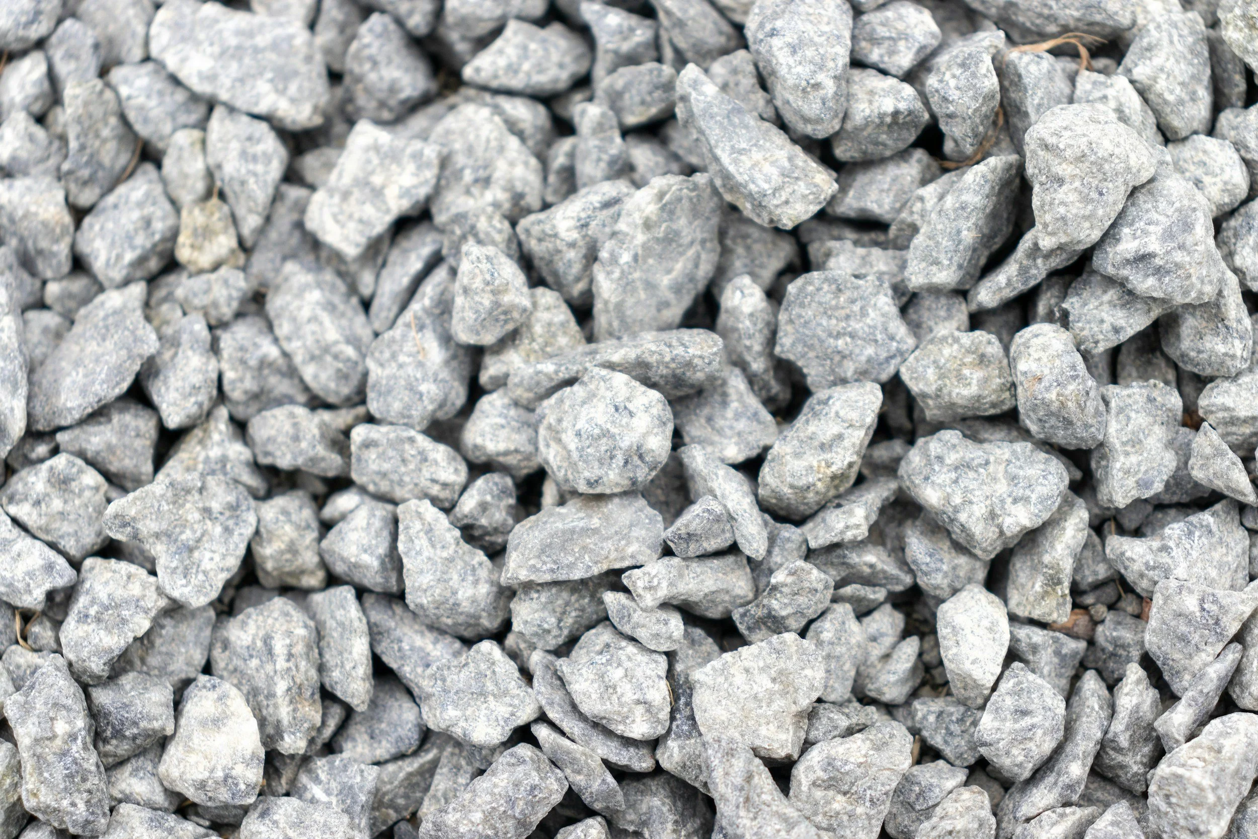 Close-up view of gray gravel stones piled together.
