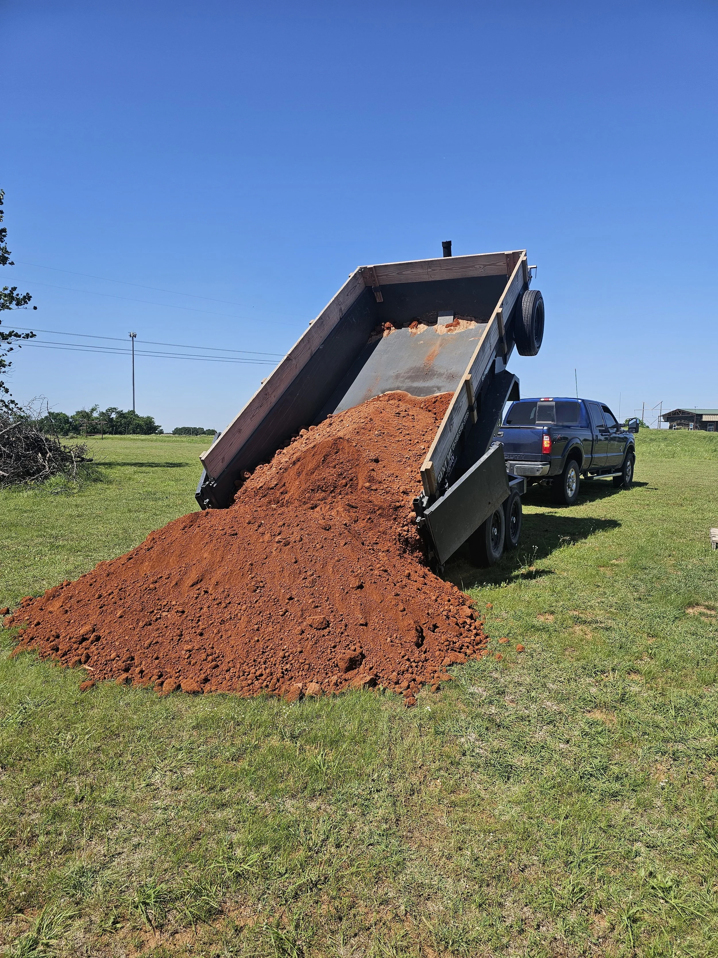 Nubs Services dump trailer delivering gravel and landscaping materials in Duncan OK