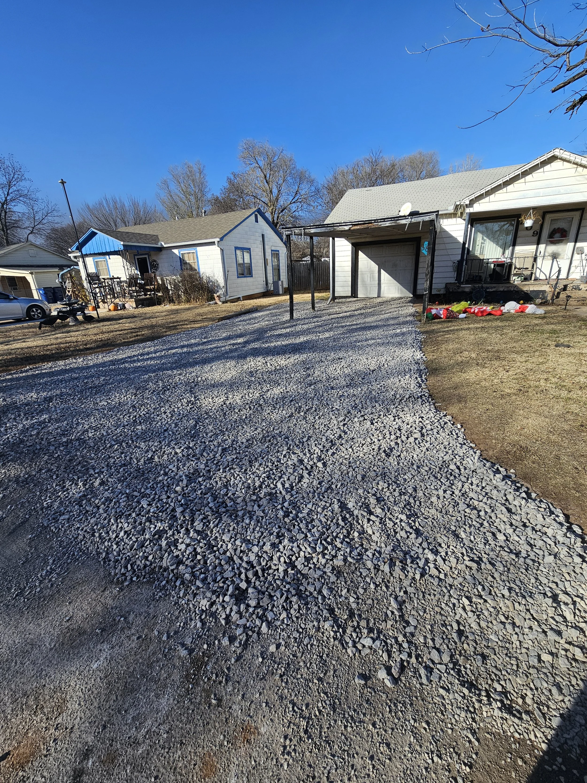 New gravel driveway installation with delivered crushed stone in Oklahoma