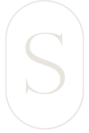 A black background with a white oval-shaped outline and a large white letter 'S' in the center.