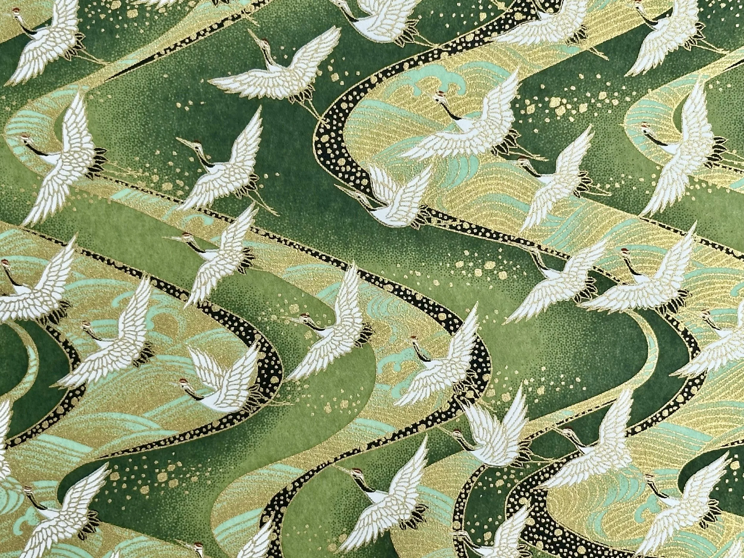 Pattern featuring white cranes with black details, gold accents, and teal waves on a green background.