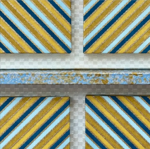 Close-up of four fabric swatches featuring diagonal striped patterns in yellow, blue, and brown shades.
