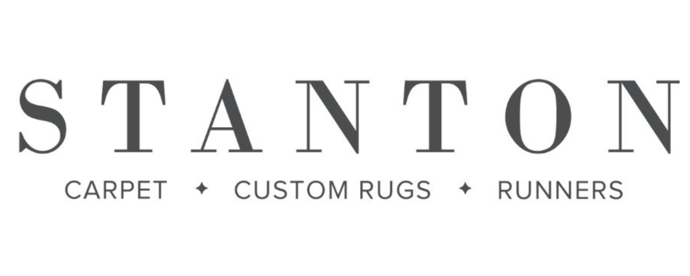 Logo of Stanton featuring the text 'Stanton' with subtext 'Carpet • Custom Rugs • Runners.'