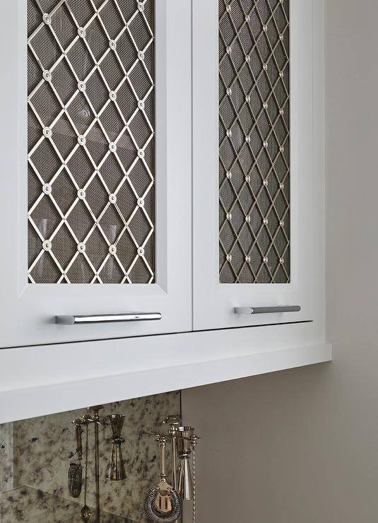 Introduce a touch of modern sophistication to your kitchen with wire cabinet inserts, effortlessly combining functionality and style to showcase your culinary essentials with a chic and contemporary flair.
