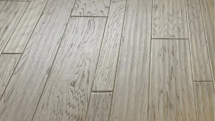Light-colored wooden floor with a natural grain pattern