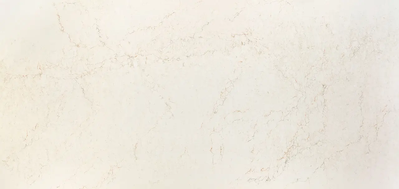 Cambria Ridgegate quartz countertop surface with a warm cream background and a fine lattice of interconnected veins in copper and tan.
