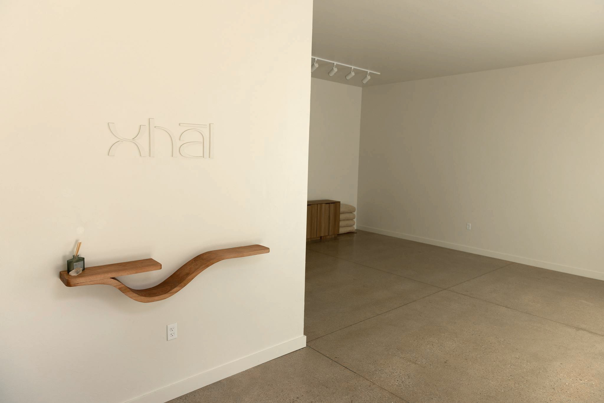 xhāl entry sign and oepn studio.jpg