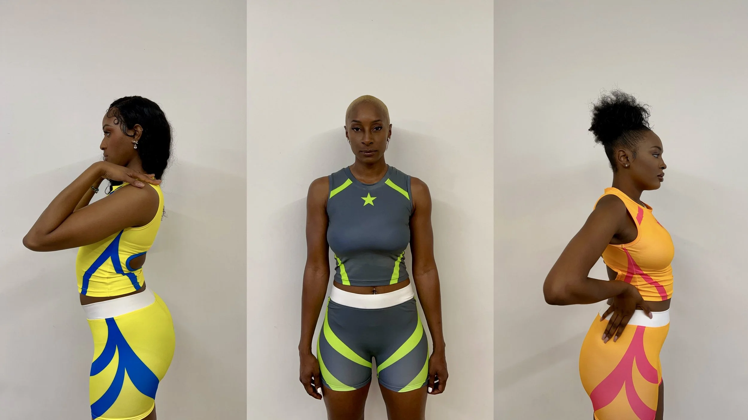 Three women in athletic wear with colorful patterns, standing against a plain white wall, viewed from the side on the left and right with the woman in the middle facing forward.