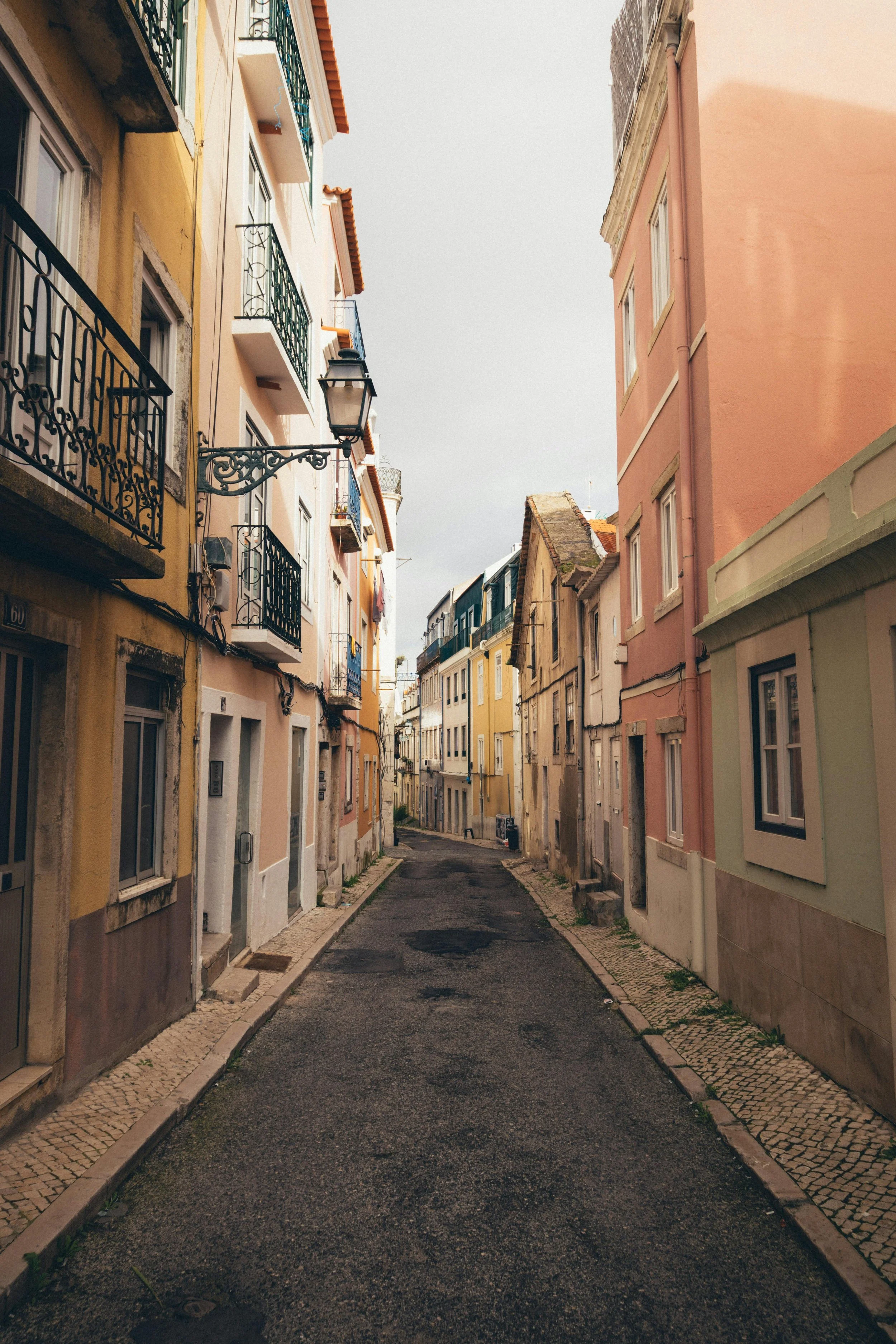 A historic street scene in Lisbon with traditional architecture.