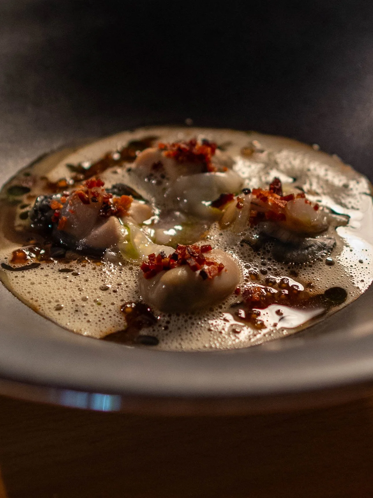 A plate of poached oysters from Aurora's new menu