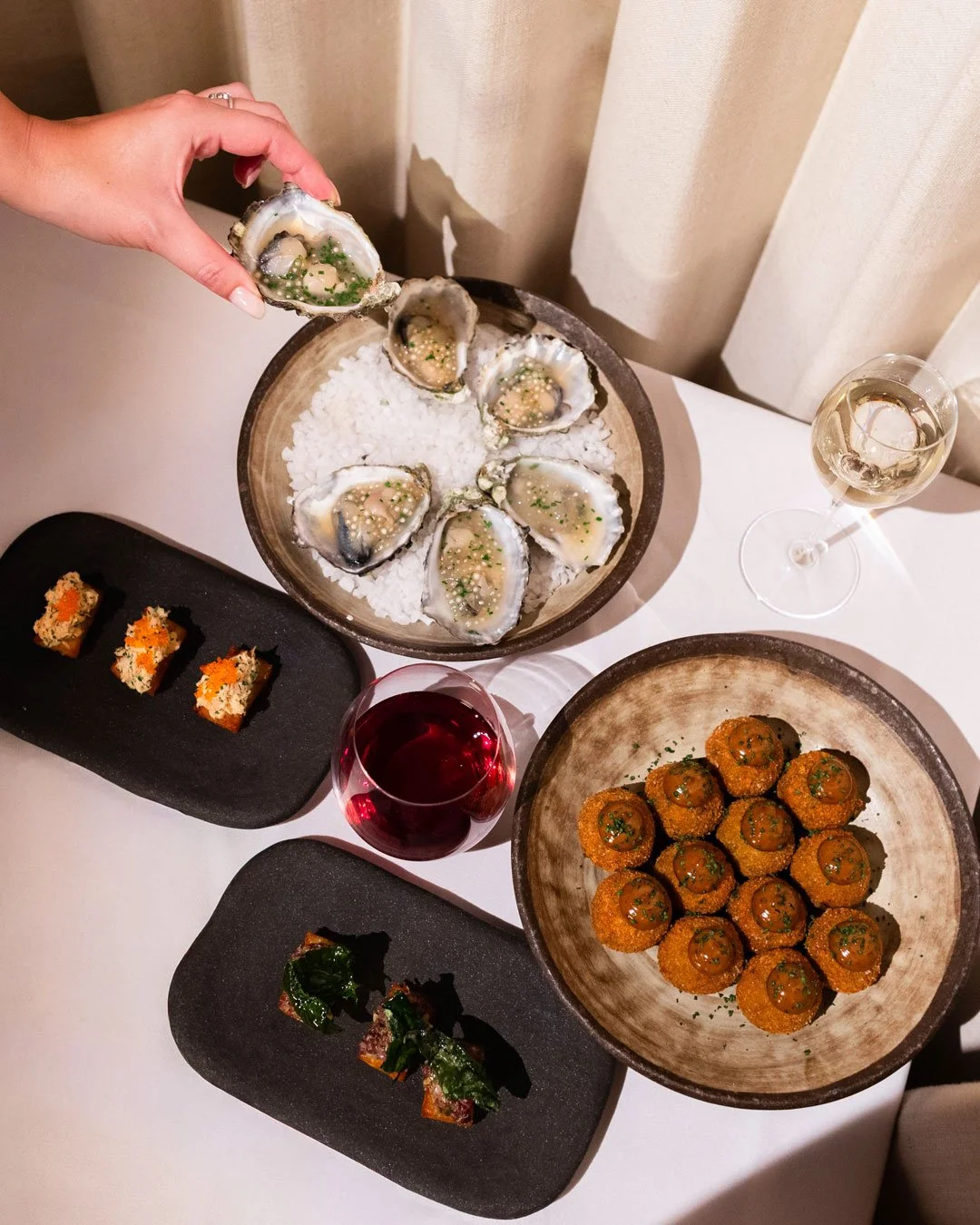 A spread of catering dishes from Aurora restaurant