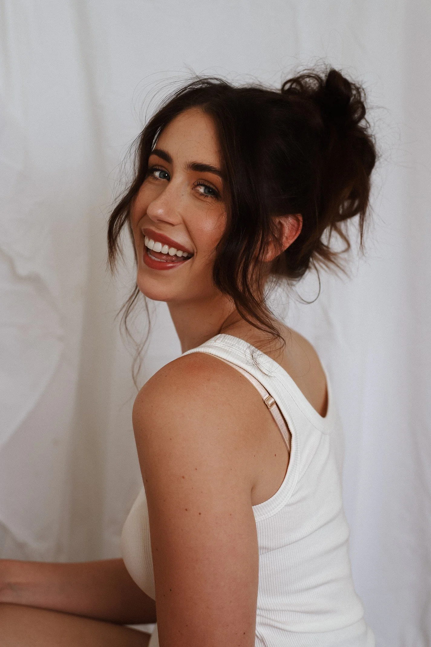 Sammy Asvestas, Co-Founder of Late Set Studio, smiling in studio portrait