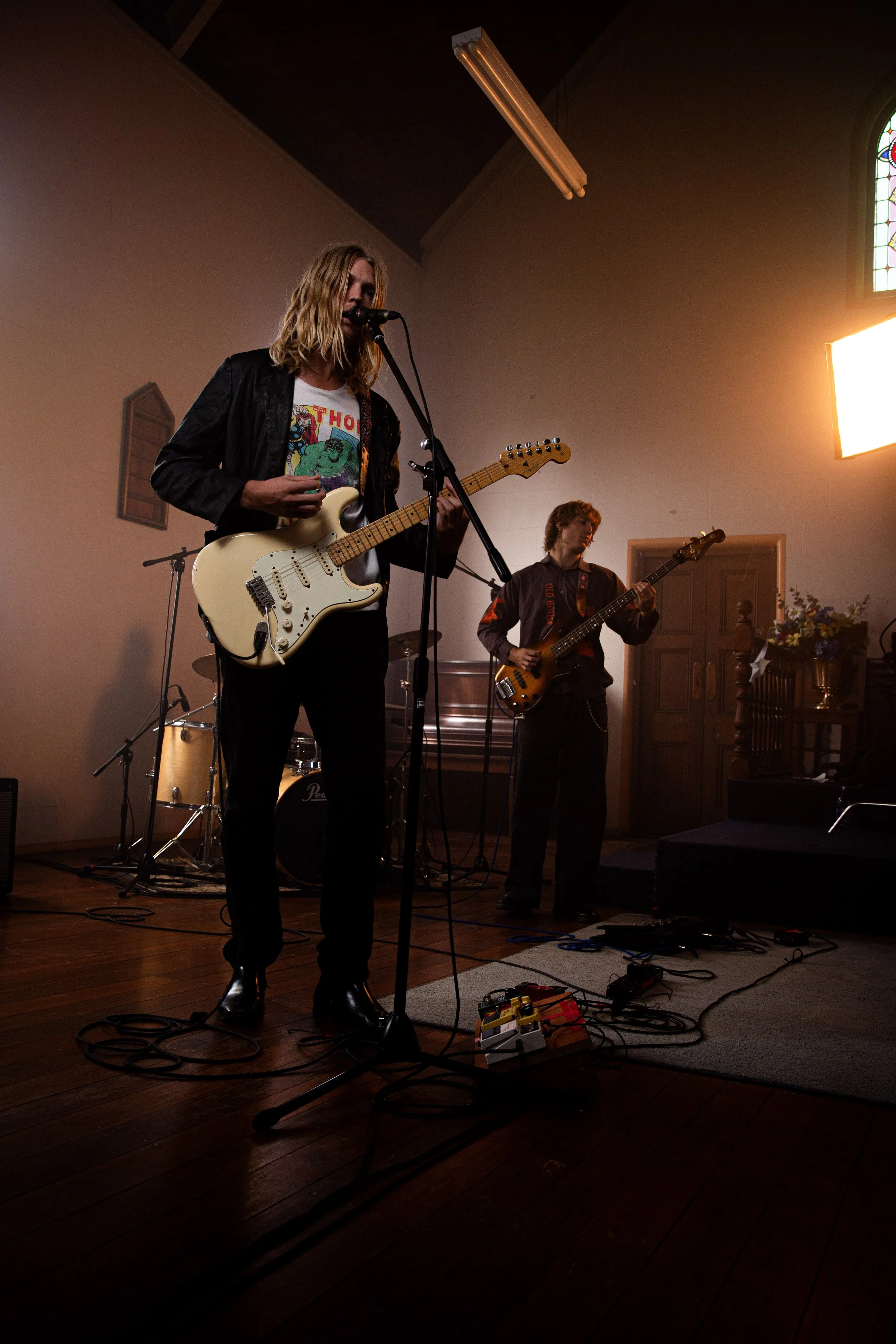 Band performing live in an intimate venue, the kind of artist led campaign work Late Set Studio supports