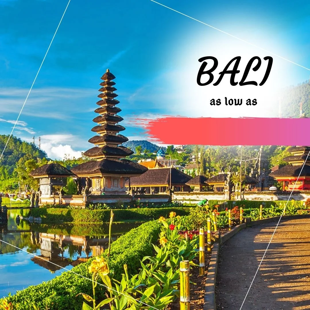 Bali temple with traditional multi-tiered pagoda-style structures surrounded by lush greenery, reflecting in the water, under a blue sky with some clouds.