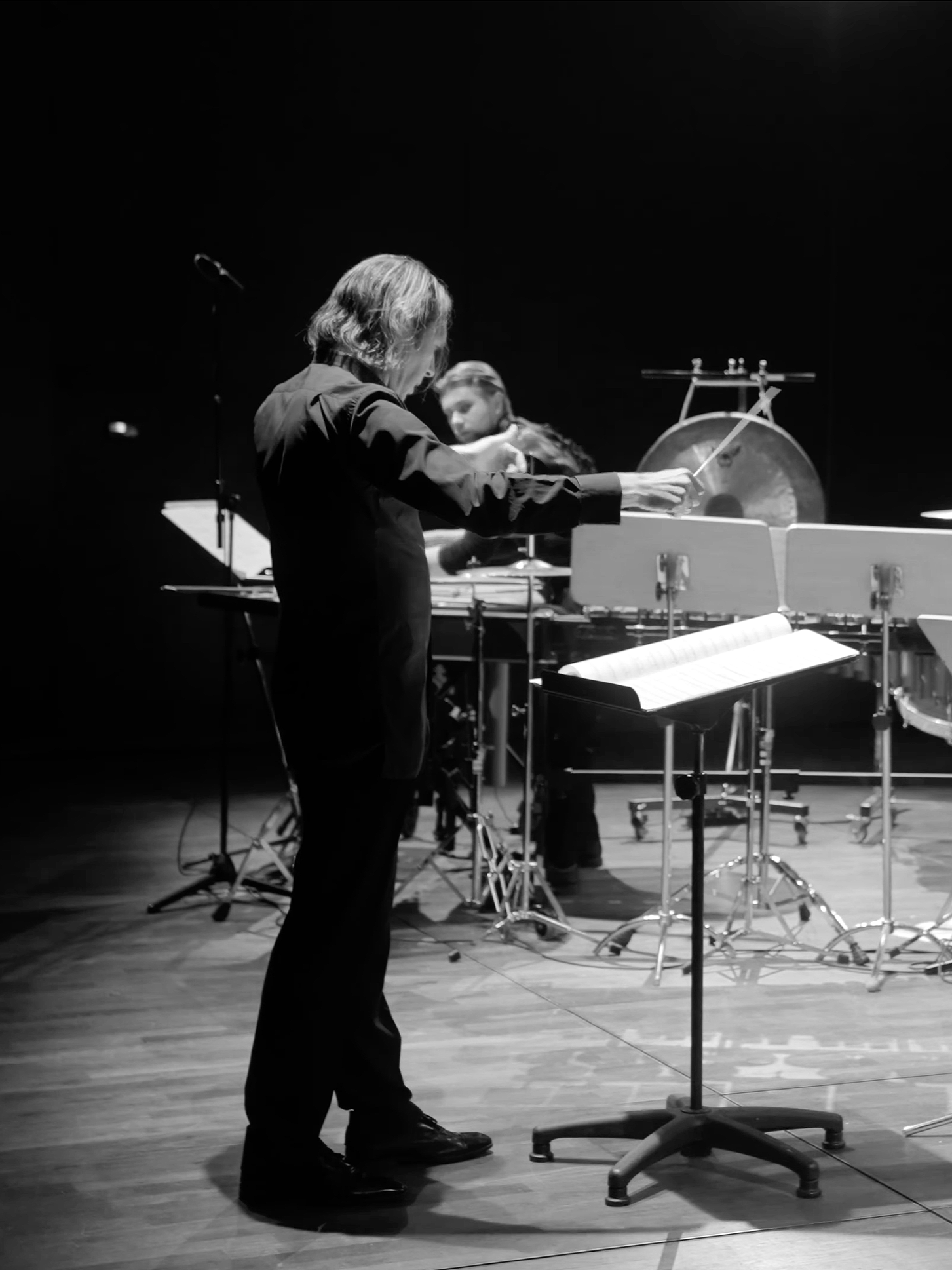Conductor performing live on stage, captured during a multi-camera classical music concert film production by EMIO Films.