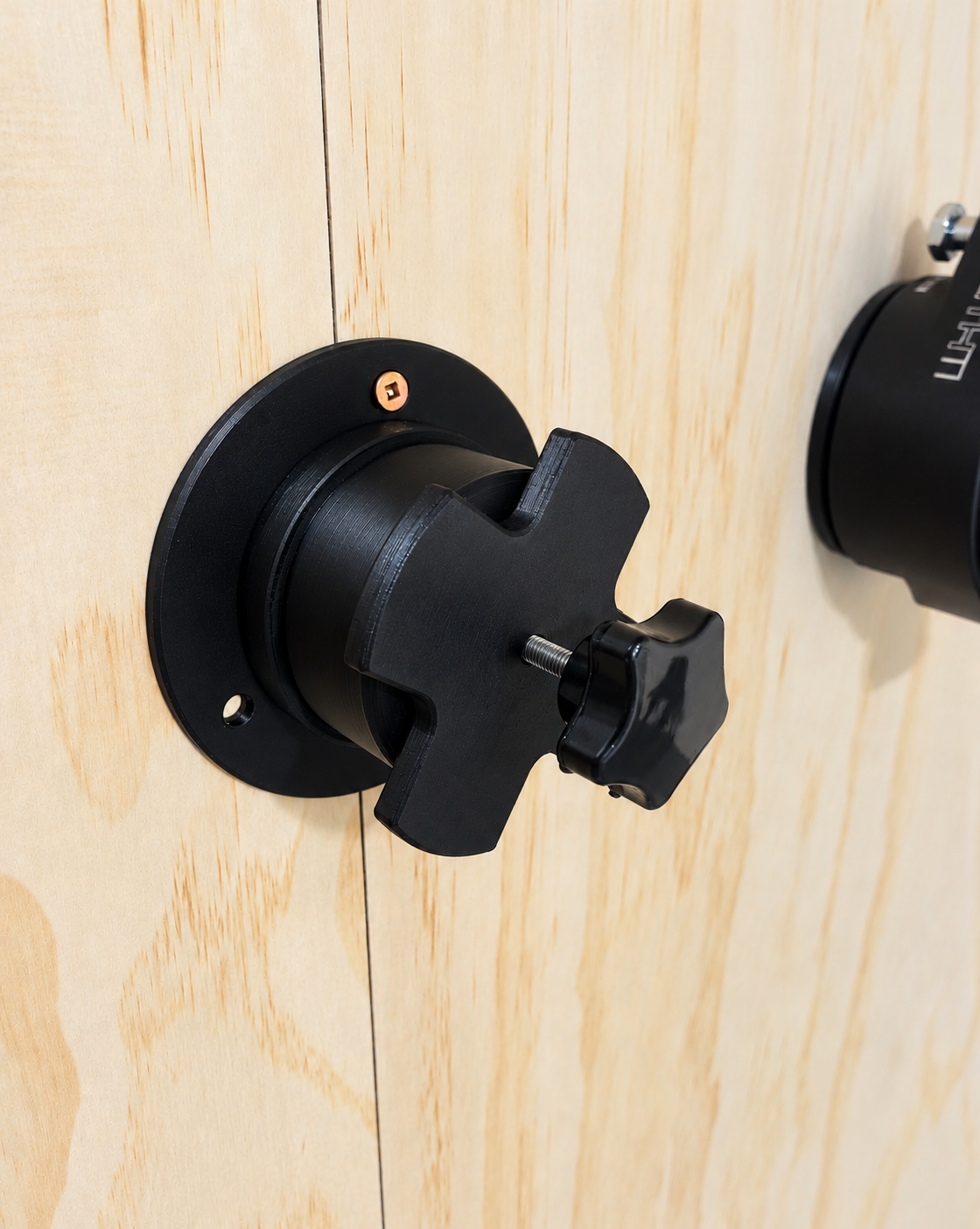 Clean Black Wall-Mounted Rotating Holder.png