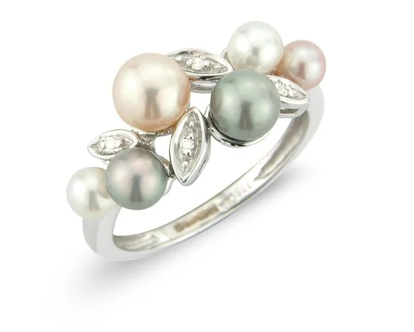 Silver ring adorned with multicolored pearls and small clear stones flower and petal style