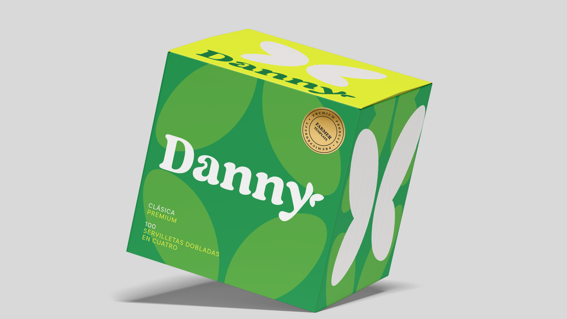 Caja de galletas etiquetada 'Danny', de color verde con diseño de círculos, con un sello dorado y recinto de cucharas de plástico en su lado.