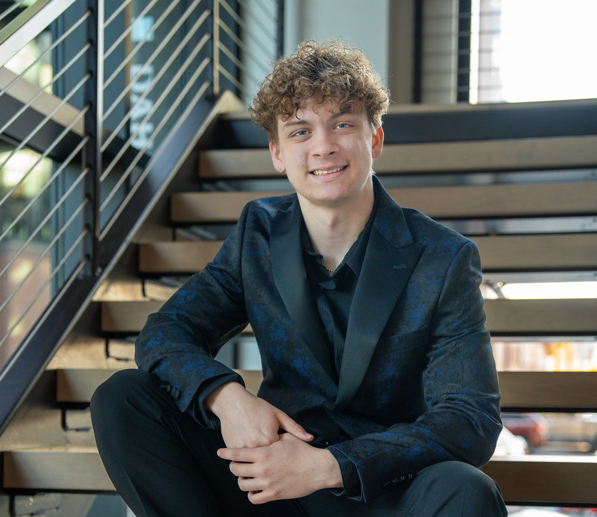 man on stairs bork productions senior photography sioux falls south dakota steel district downtown