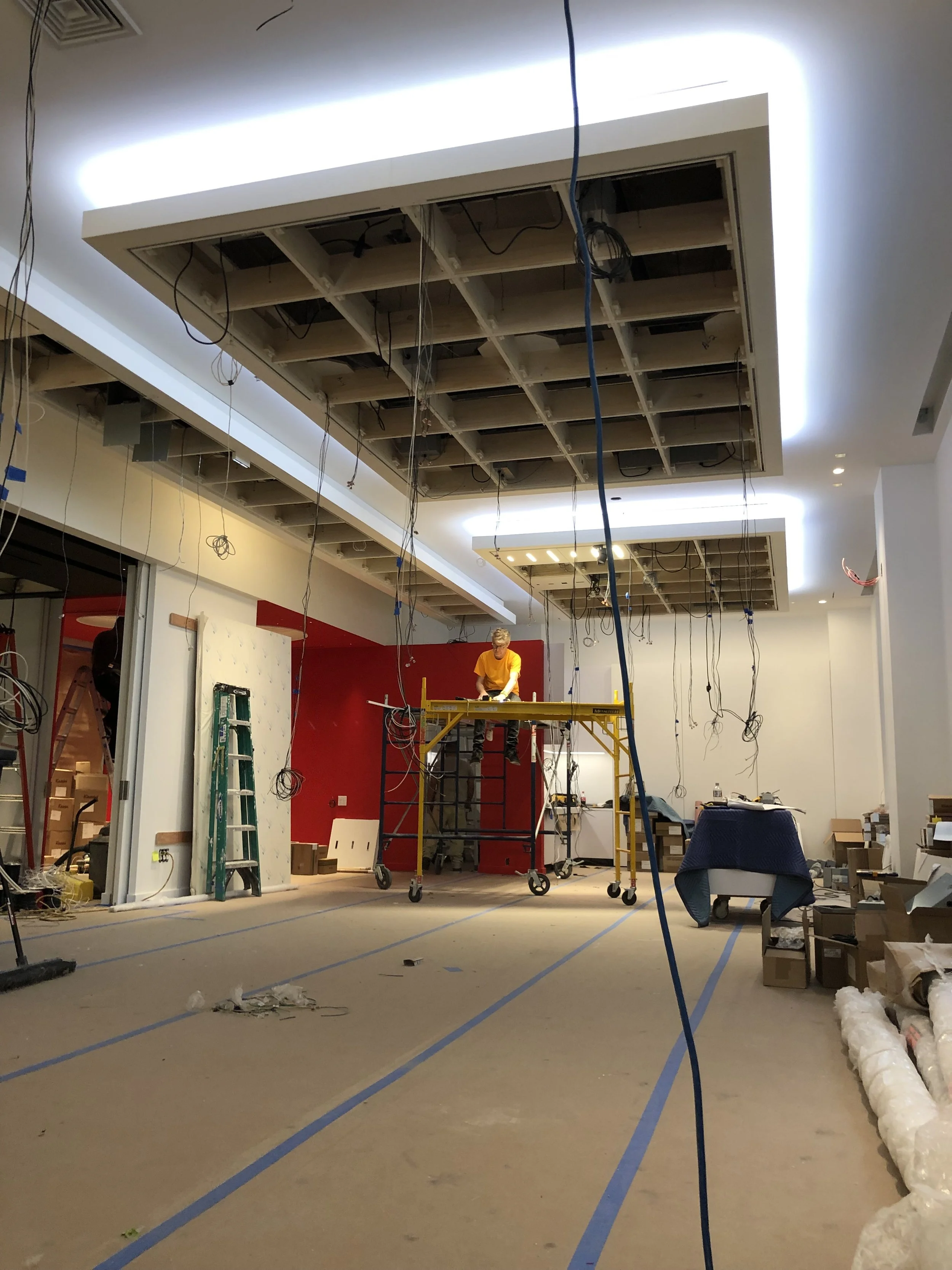 Commercial interior construction project managed by Conquest Management, including electrical infrastructure, lighting installation, facility improvements, and tenant build-out services in New York City.