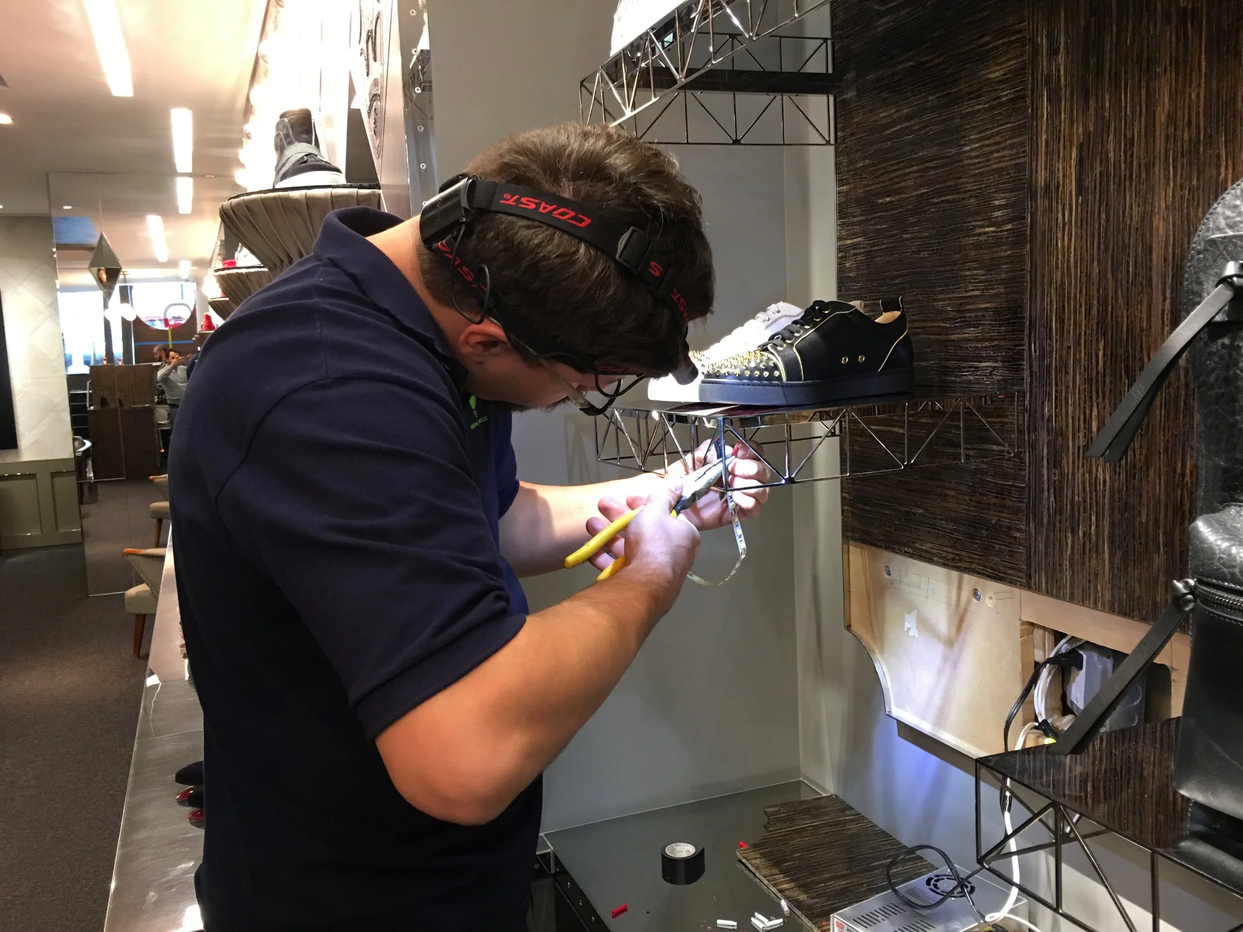 Conquest Management technician performing electrical maintenance and operational support services for a retail environment in New York City.