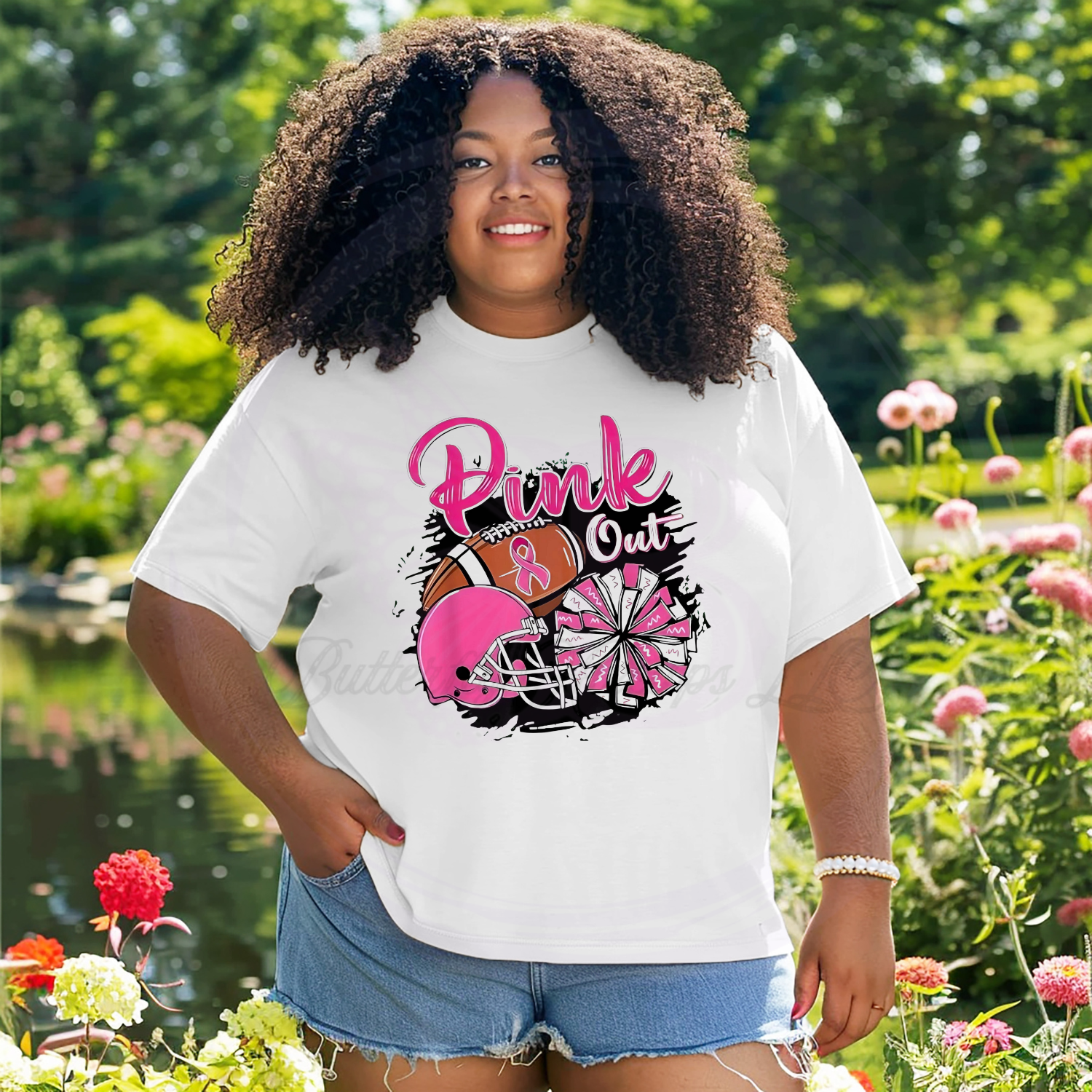 The shirt features a "Pink Out" logo, which is a common theme used to show support for breast cancer awareness.