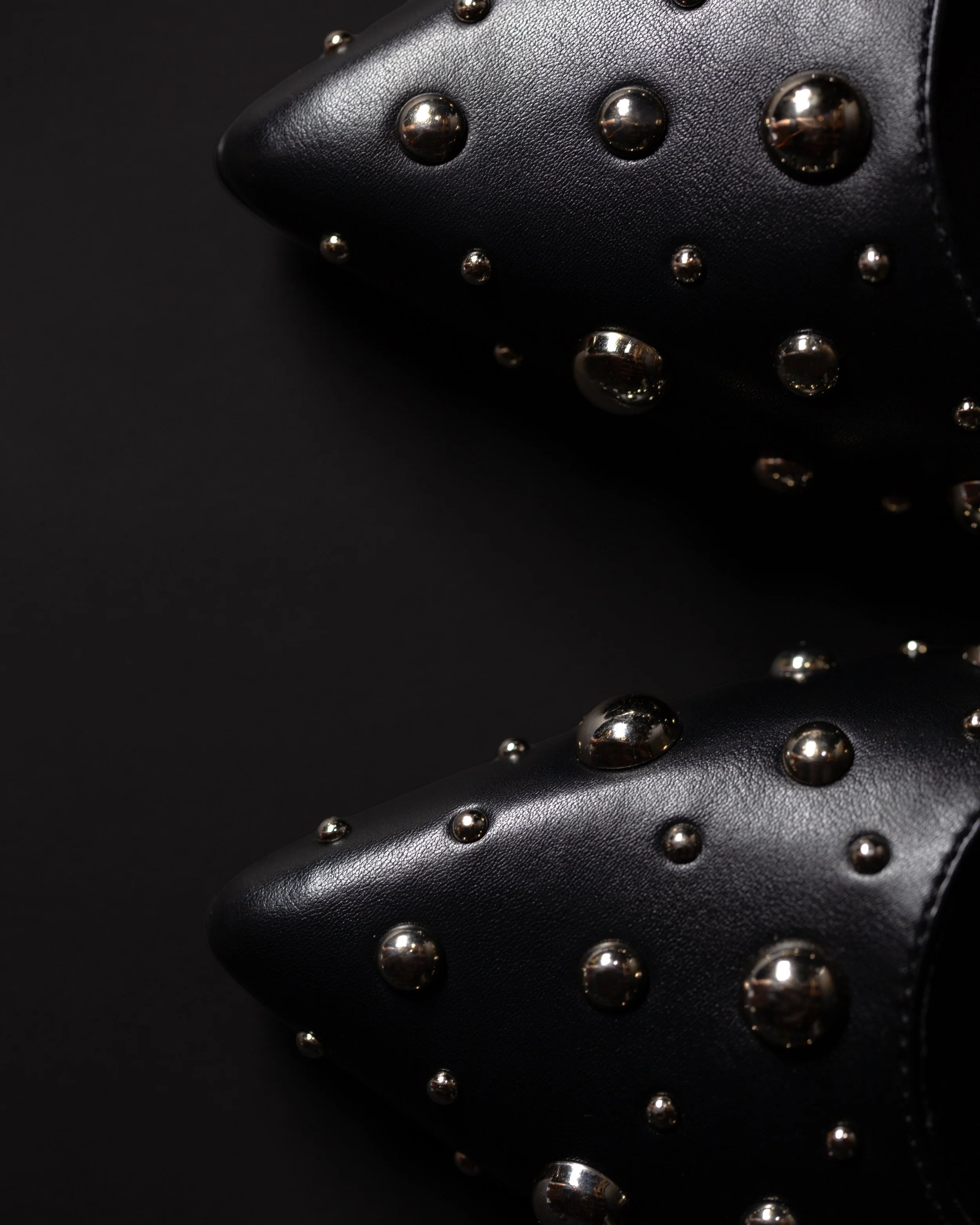 Black stuffed flats, up close.