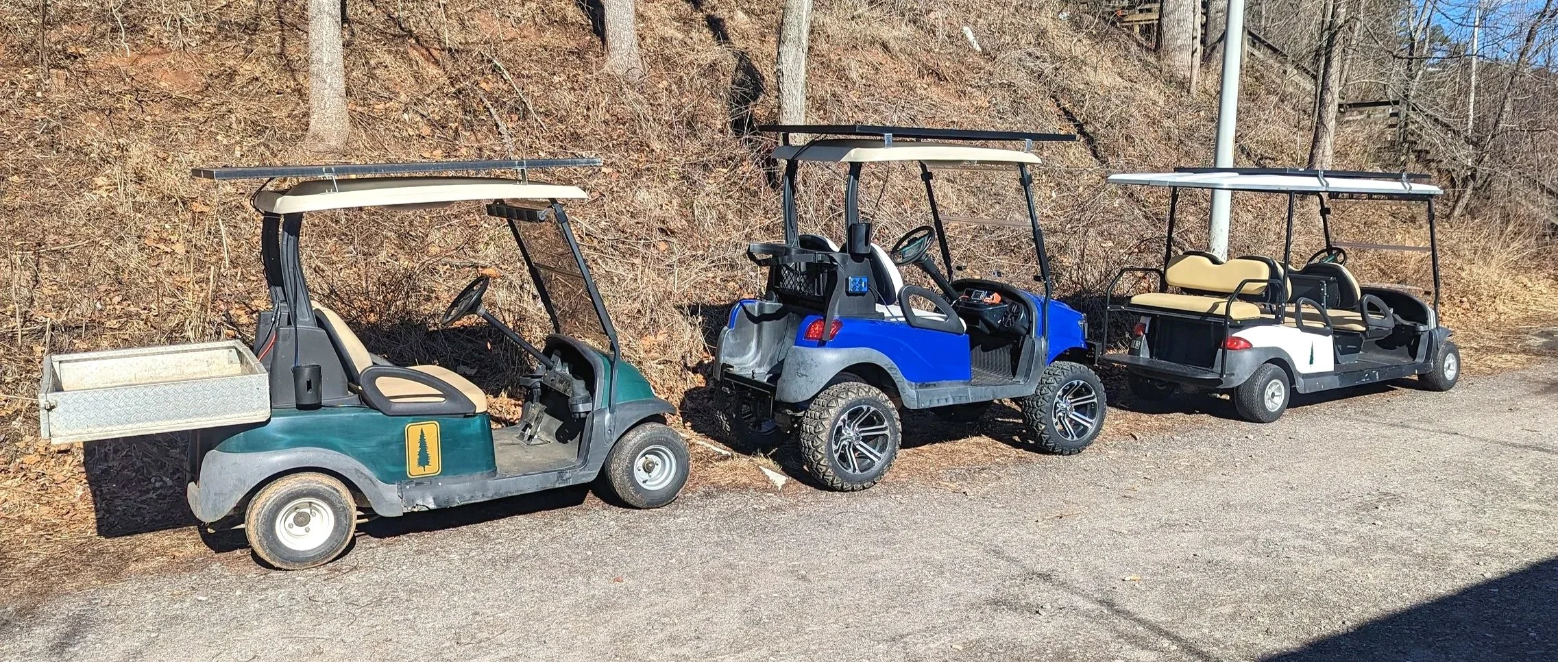 Upcycled golf carts, that have been transformed with solar power systems, transforming them into work utility vehicles, in Swannanoa, NC.