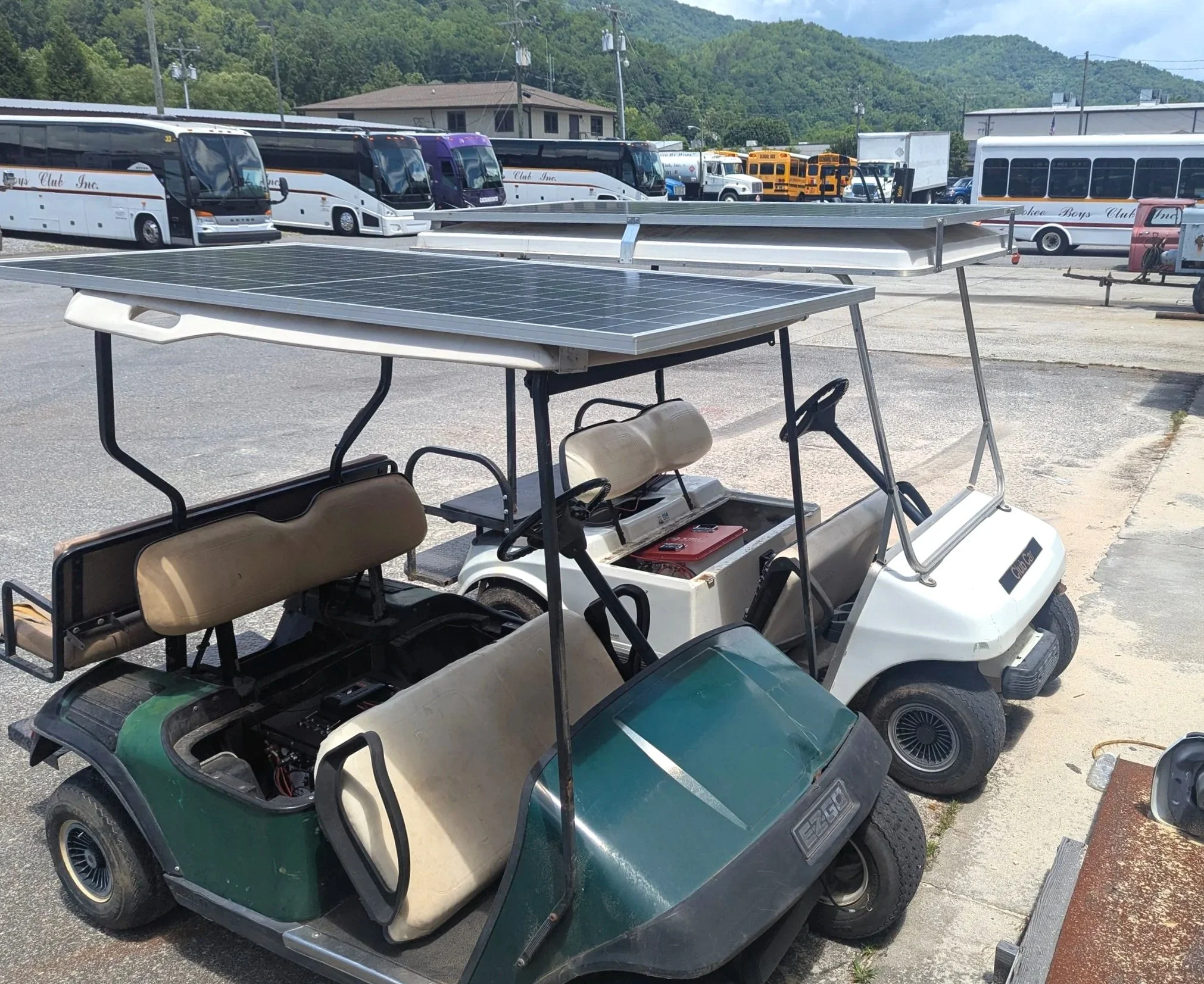 Converted golf carts - upgraded with all electric solar power system that transforms them into utility work vehicles.