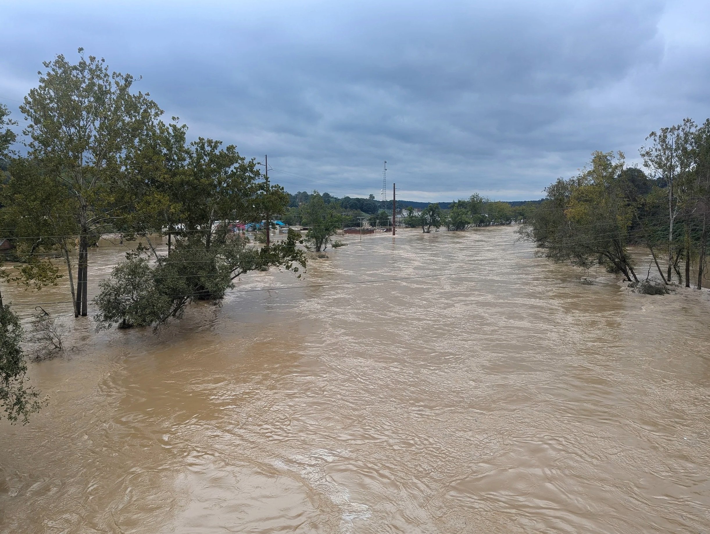 French Broad River in Asheville, NC during the catastrophic flooding caused by  hurricane Helene.