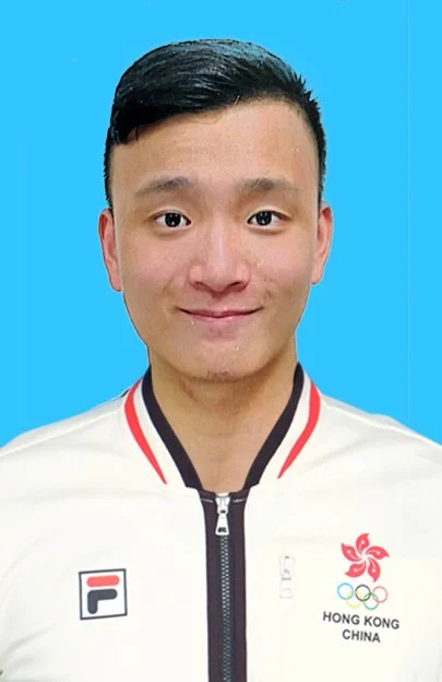 A young man with short black hair wearing a white jacket with a zipper, featuring a Hong Kong China logo and the Olympics emblem, against a blue background.